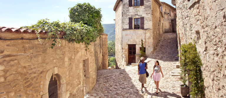 Students walking by exterior of Lacoste library