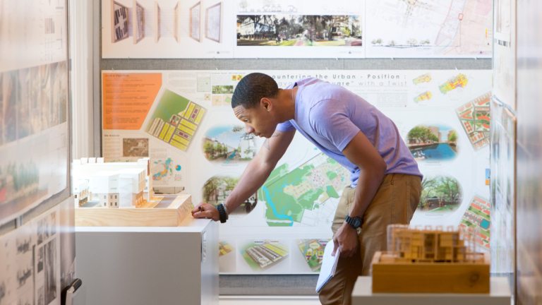 Architecture student viewing NAAB exhibit