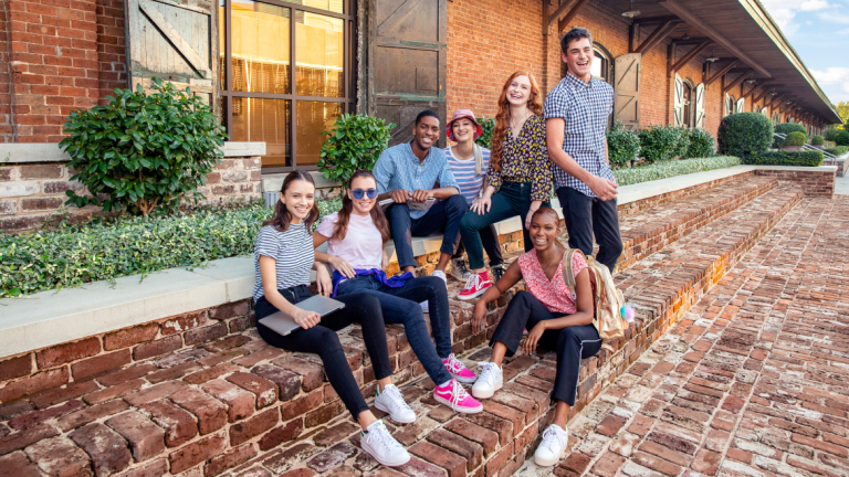 SCAD students laughing outside Clark Hall