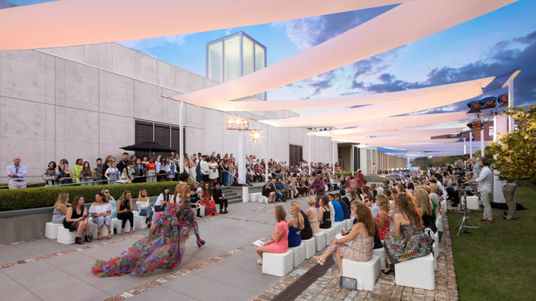 Model walking runway at Savannah fashion show at scad museum