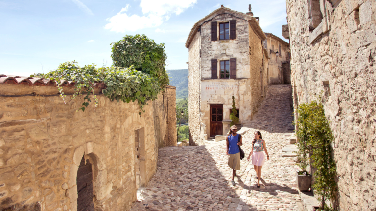 Students walking by exterior of Lacoste library