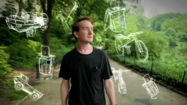 SCAD alumnus Nick Baker with industrial design sketches around head