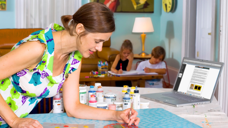 eLearning student painting at home with family