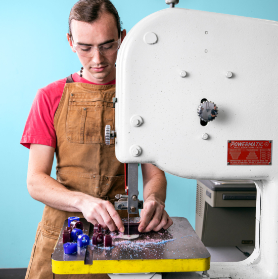 Jewelry student works on equipment in Fahm Hall